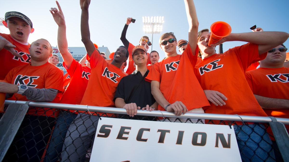 image of greek life students at football game
