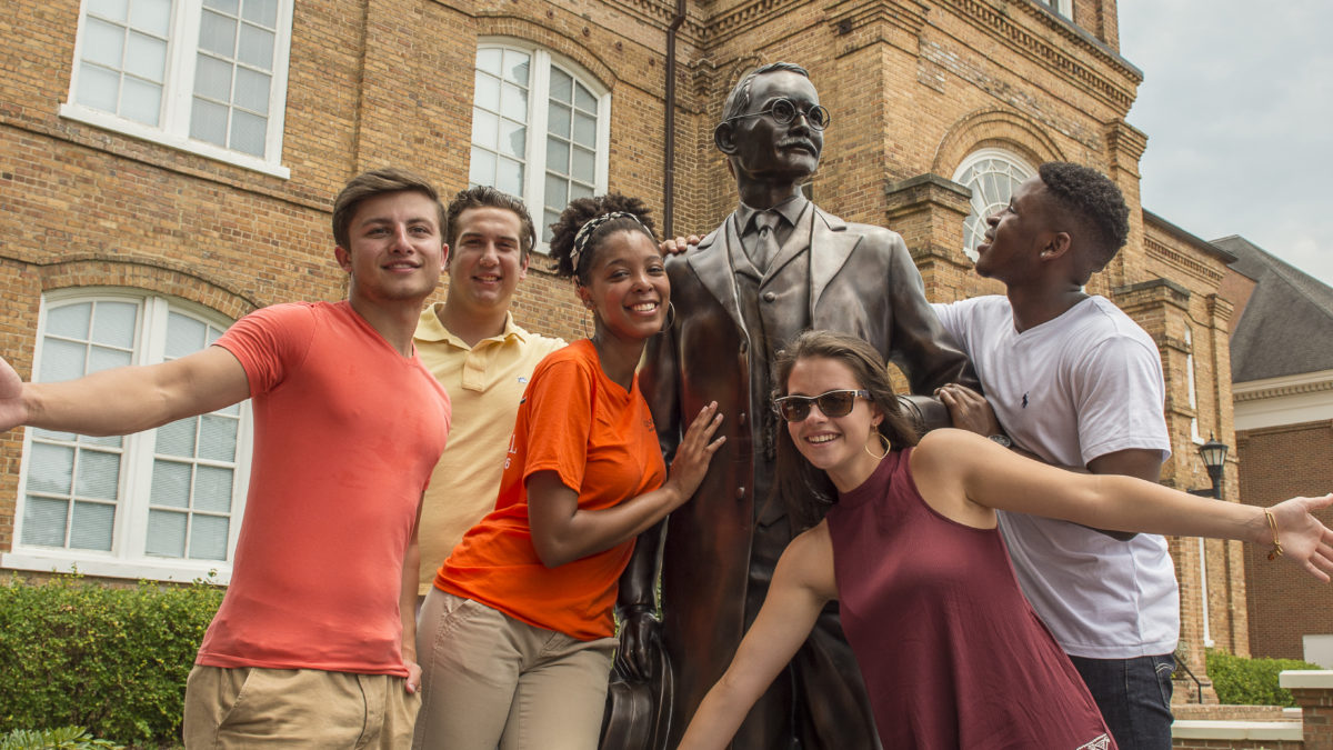 image of students with ja campbell statue