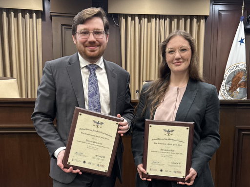 Photo of Campbell Law advocates Darren Stephens ‘26 and Alexandra Rye ‘27 holding awards